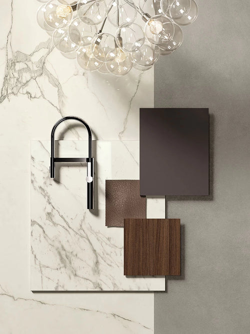 Calacatta Extra marble surface with gray veining and modern black faucet — custom countertops fabricated and installed by Signature Stone LV