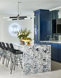 Quartz kitchen island with dramatic white and gray veining and waterfall edge — premium stone countertops installed by Signature Stone Las Vegas