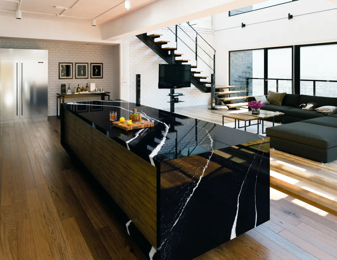 Black marble kitchen island with dramatic white veining and waterfall edge — premium stone countertops installed by Signature Stone Las Vegas