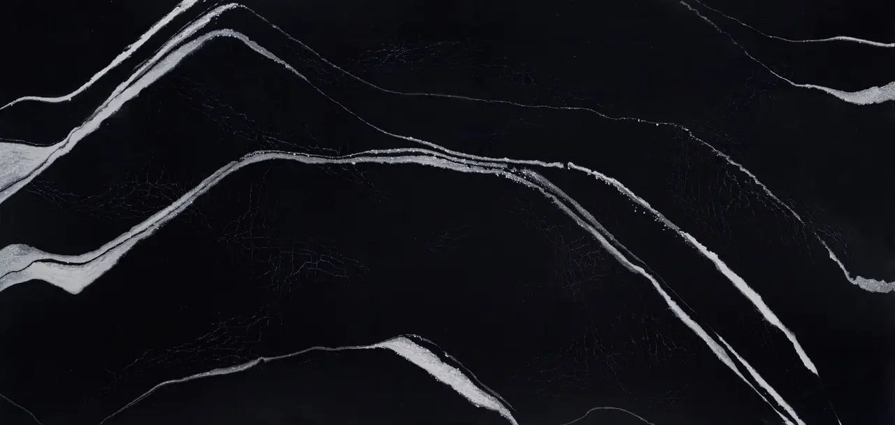 Mersey quartz slab with dramatic black base and flowing white veining — ideal for custom countertops fabricated and installed by Signature Stone LV