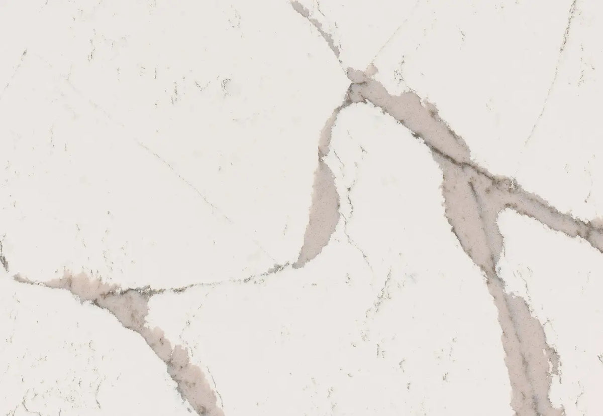 Quartz surface with white background and subtle gray veining in elegant natural pattern — premium countertop fabrication by Signature Stone Las Vegas