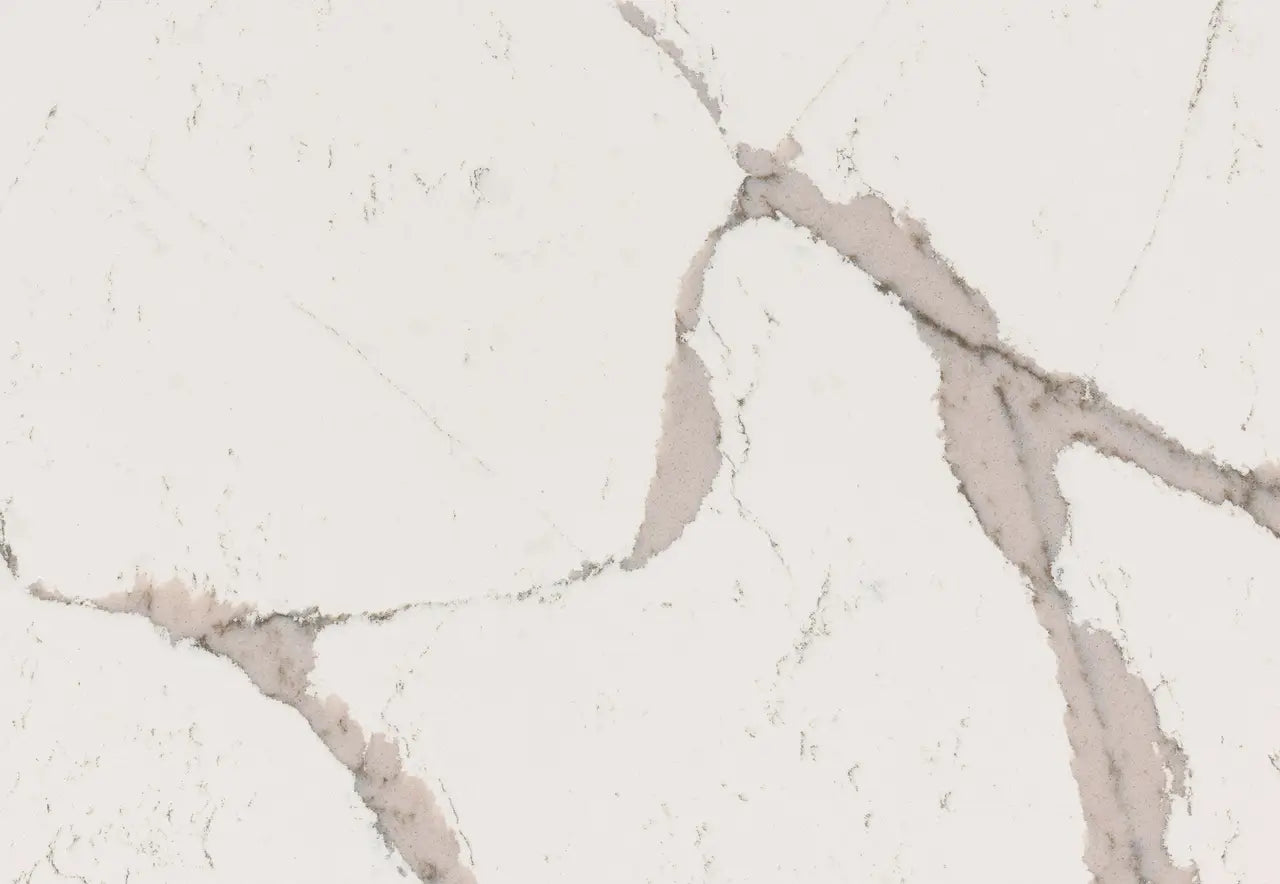 Quartz surface with white background and subtle gray veining in elegant natural pattern — premium countertop fabrication by Signature Stone Las Vegas