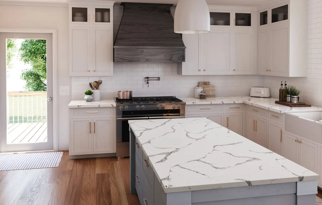 Calacatta quartz kitchen island and perimeter countertops with white marble veining and polished finish — premium stone countertops installed by Signature St...