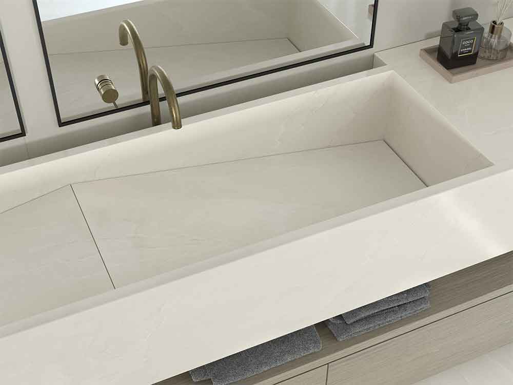 Namibian White stone bathroom vanity with clean white finish and integrated rectangular sink — custom countertop fabrication by Signature Stone Las Vegas