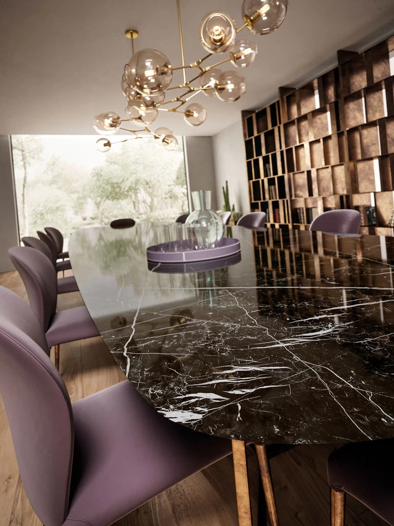 Nero Marquina marble dining table with dramatic black surface and white veining — premium stone countertops installed by Signature Stone Las Vegas