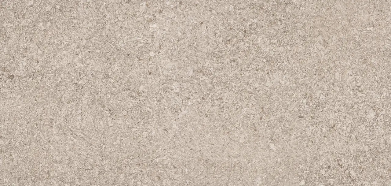 New Quay quartz surface with warm beige tones and subtle natural veining — custom countertops fabricated and installed by Signature Stone LV