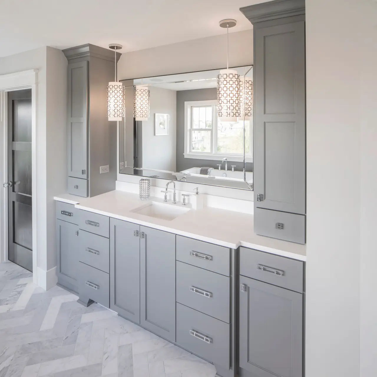 Quartz bathroom vanity with white surface and gray shaker cabinets — elegant stone countertops installed by Signature Stone Las Vegas