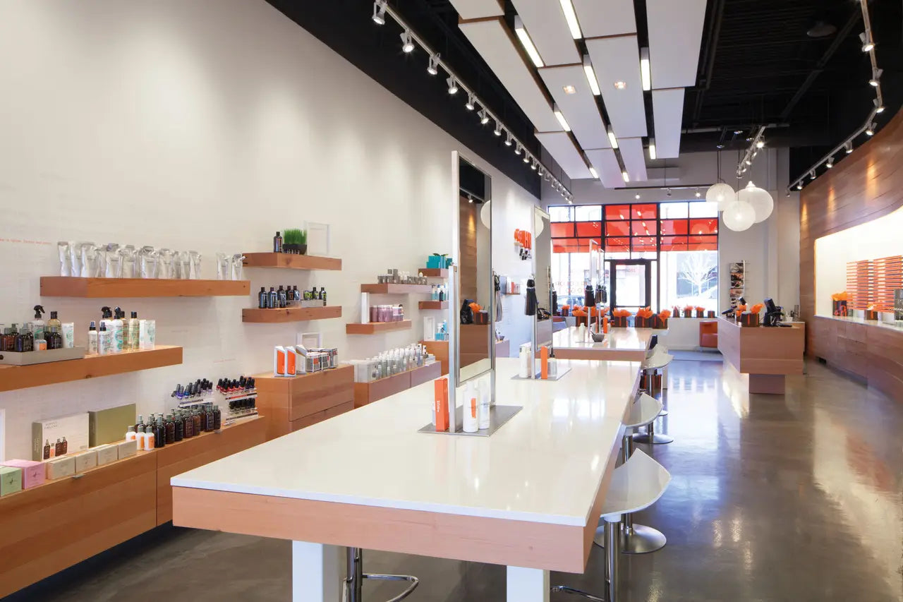 White quartz countertop island with clean edges in modern retail space — custom countertops fabricated and installed by Signature Stone LV