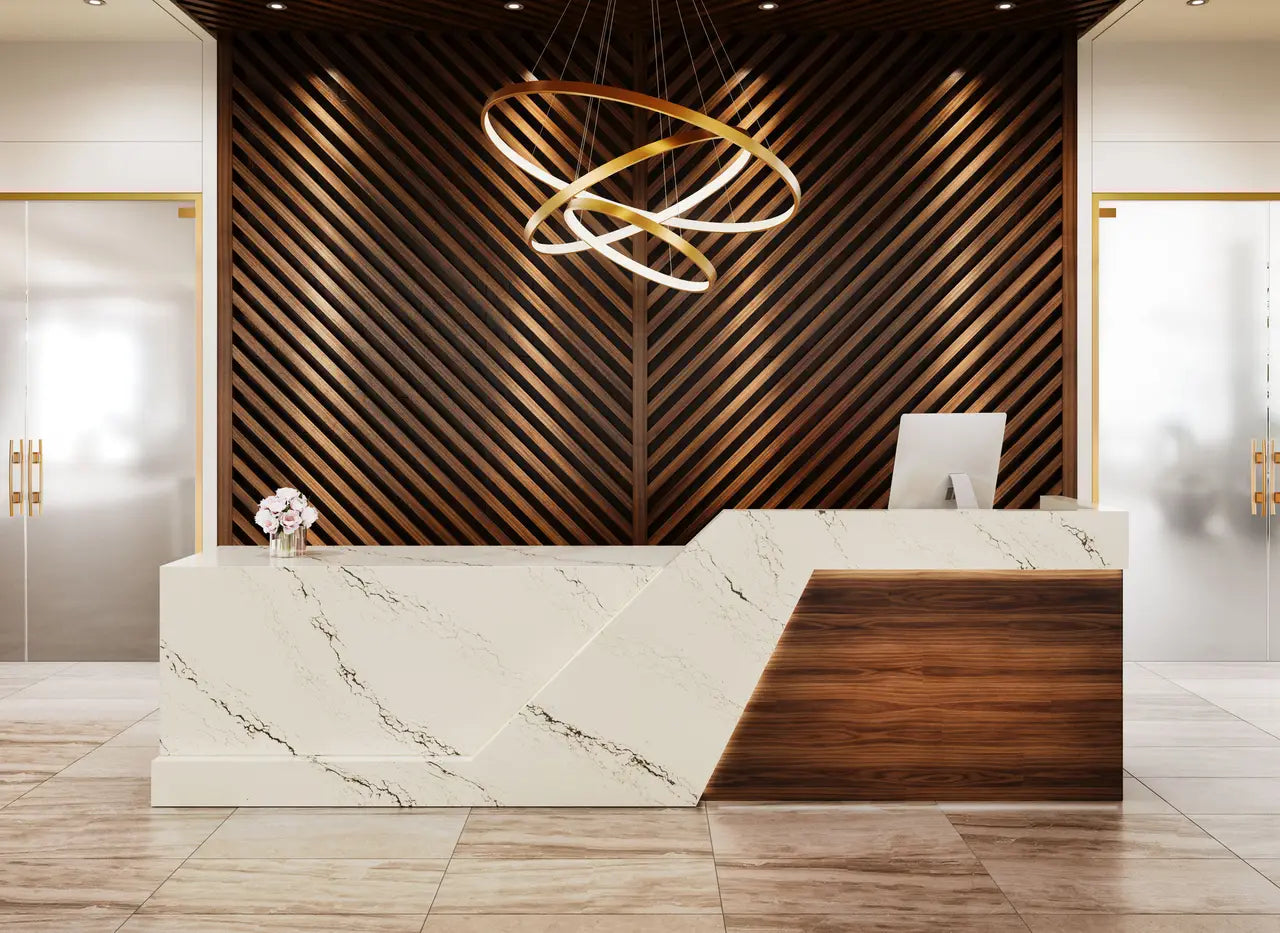 Calacatta marble reception desk with white veining and waterfall edge — premium stone countertops installed by Signature Stone Las Vegas
