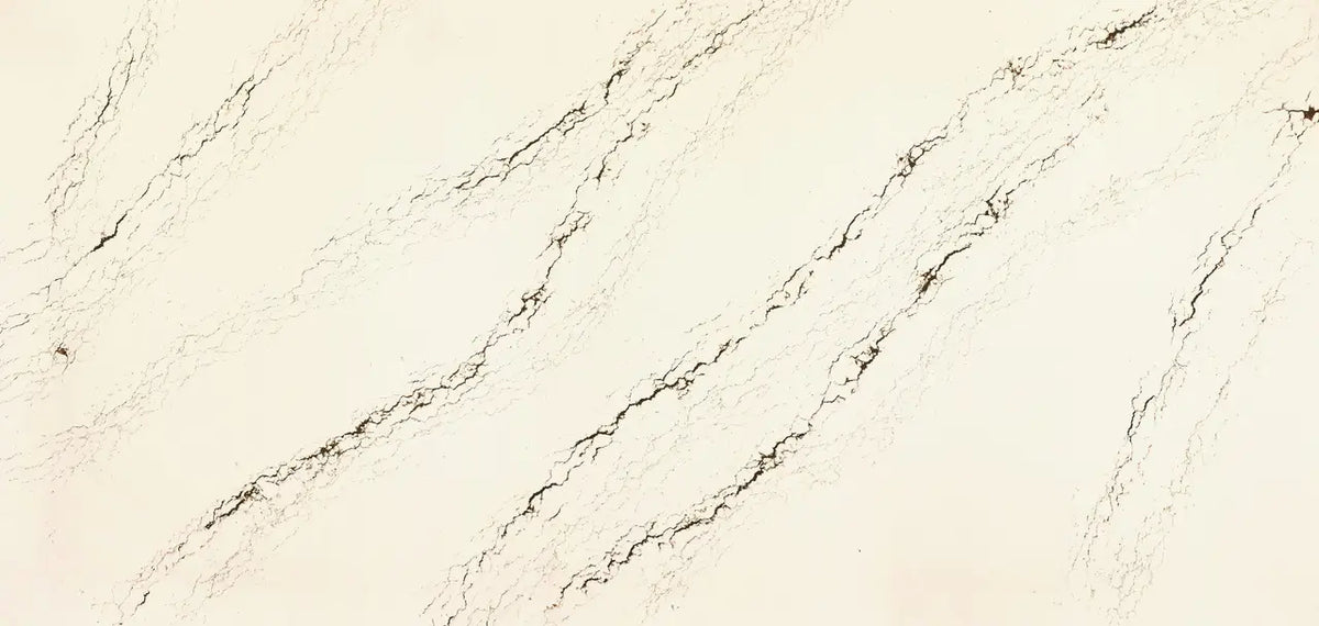 Quartz slab surface with cream base and diagonal brown veining pattern — custom countertops fabricated and installed by Signature Stone LV