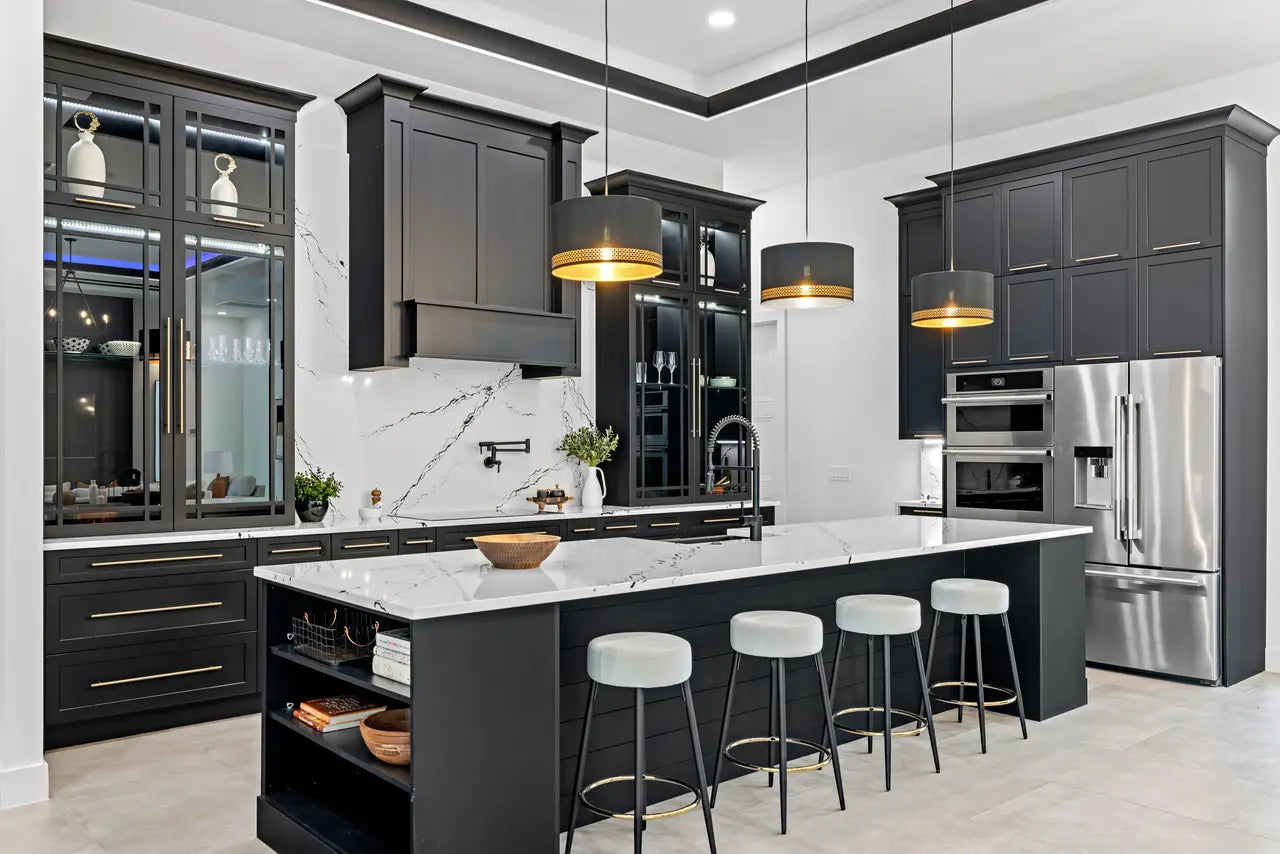 Calacatta quartz kitchen island and perimeter countertops with white marble veining and polished finish — elegant stone countertops installed by Signature St...