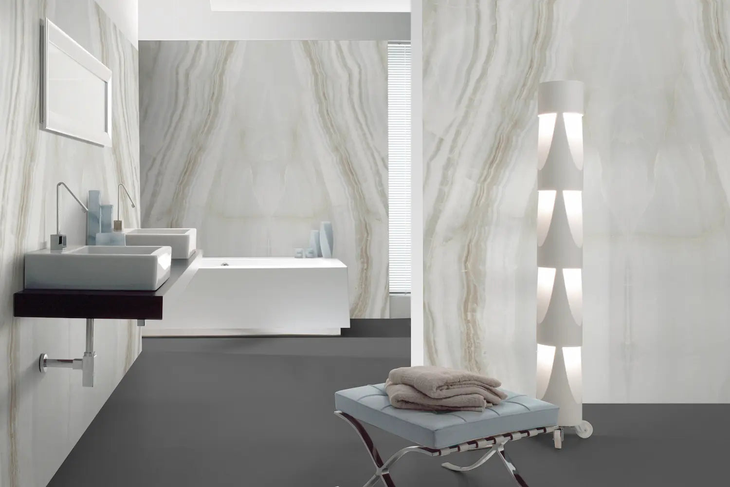 Onyx bathroom vanity with flowing white and gold veining pattern — elegant stone countertops installed by Signature Stone Las Vegas
