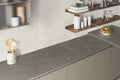 Pietra Grigio kitchen countertops with dark marble veining and induction cooktop — elegant stone countertops installed by Signature Stone Las Vegas