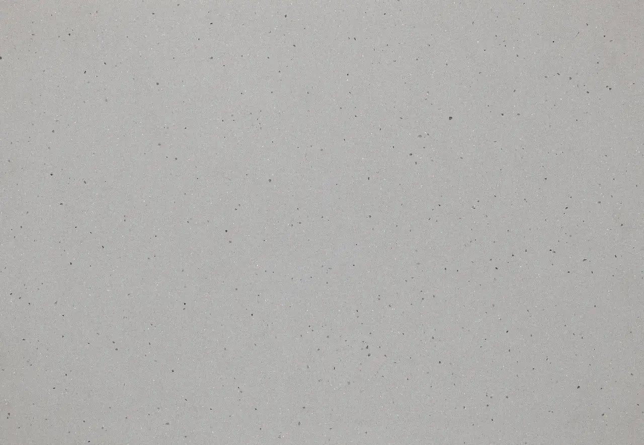 Pikes Peak quartz slab with light gray background and dark speckled pattern — premium stone countertops installed by Signature Stone Las Vegas