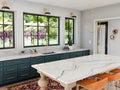 Portrush quartz kitchen island and perimeter countertops with white marble veining and polished finish — premium stone countertops installed by Signature Sto...