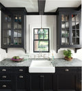 Praa Sands granite kitchen countertops with gray veining and polished finish around farmhouse sink — elegant stone countertops installed by Signature Stone L...