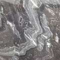 Quartzite Black Agata surface with dramatic gray and white swirled veining patterns — premium quartz countertops installed by Signature Stone Las Vegas