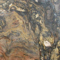 Quartzite Fusion slab with swirling golden brown and gray veining patterns — elegant quartz countertops installed by Signature Stone Las Vegas