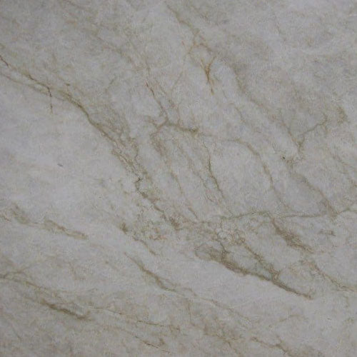 Quartzite Taj Mahal slab with soft white background and delicate gold veining — premium quartz countertops installed by Signature Stone Las Vegas