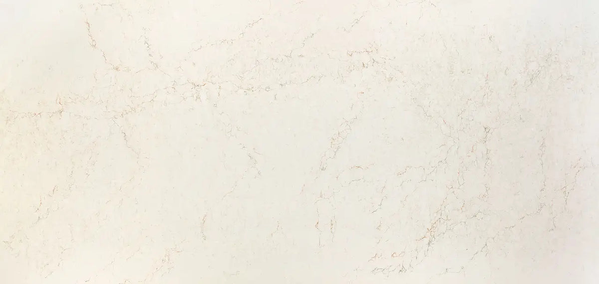 Quartz surface featuring subtle beige and cream veining with polished finish — premium countertop fabrication by Signature Stone Las Vegas