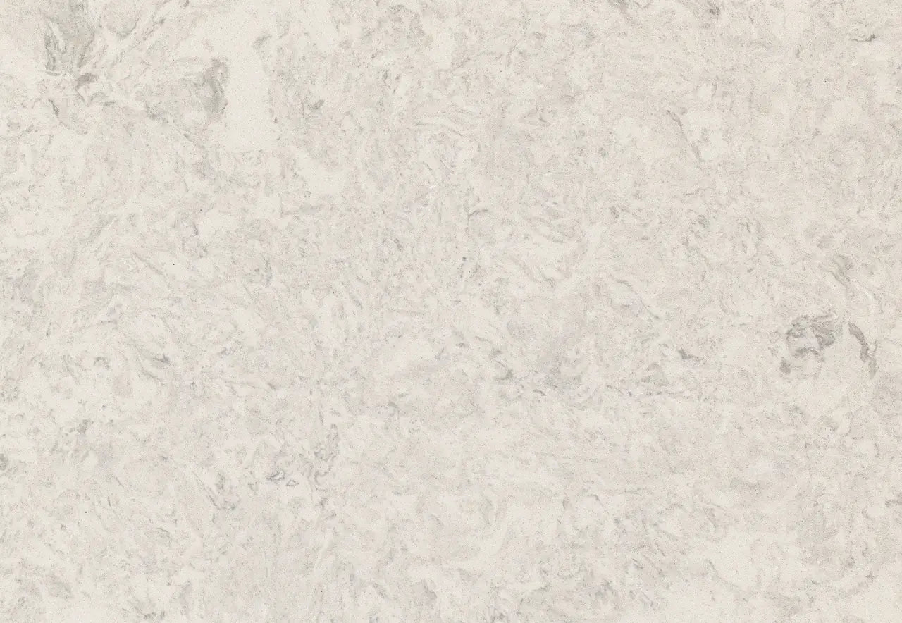 Risegate quartz surface with soft beige tones and subtle veining patterns — custom countertops fabricated and installed by Signature Stone LV