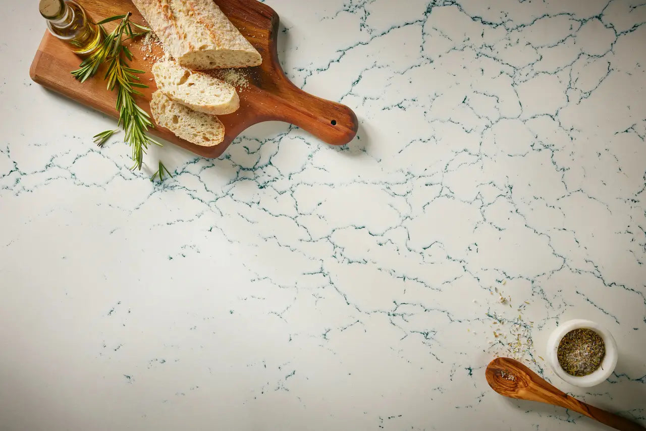 Quartz kitchen surface with white base and blue veining, polished finish — premium stone countertops installed by Signature Stone Las Vegas