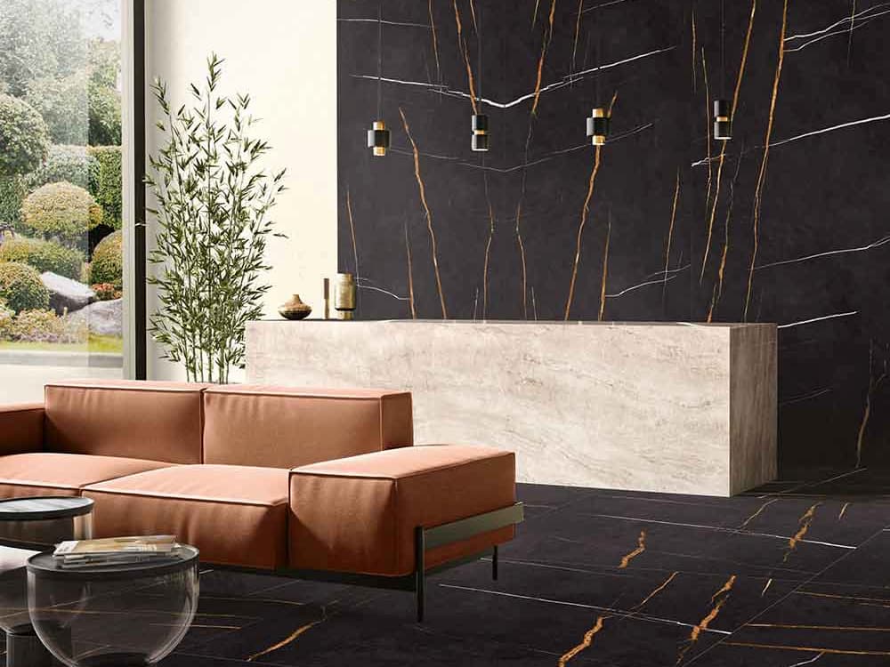 Sahara Noir marble kitchen island with dramatic black surface and gold veining — luxury stone countertops installed by Signature Stone Las Vegas
