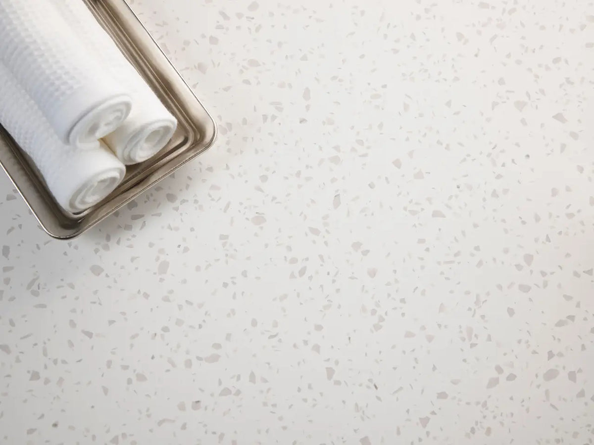 Salt Lake quartz bathroom countertop with white base and subtle gray veining — custom countertops fabricated and installed by Signature Stone LV