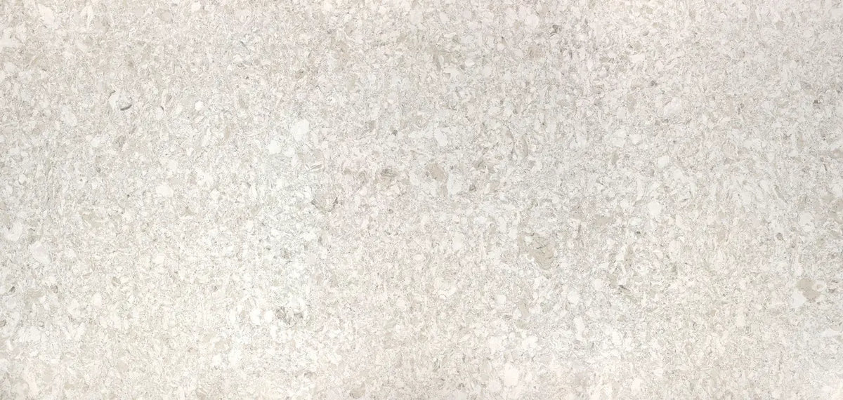 Sandgate quartz surface with light beige and cream tones in fine speckled pattern — custom countertops fabricated and installed by Signature Stone LV