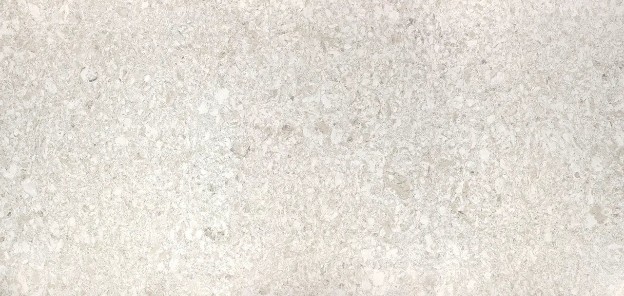 Sandgate quartz surface with light beige and cream tones in fine speckled pattern — custom countertops fabricated and installed by Signature Stone LV