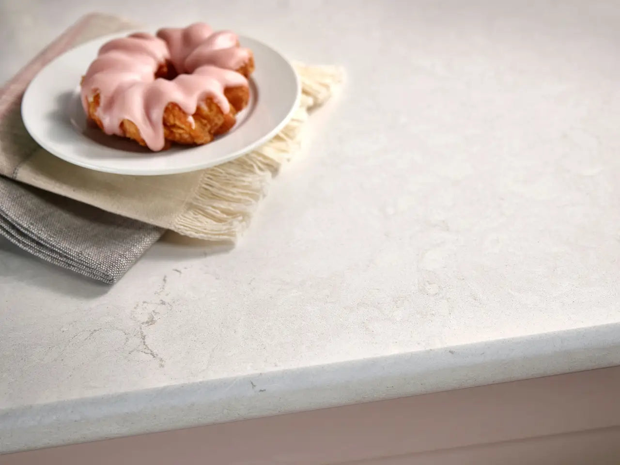 Seacourt quartz kitchen countertop with white marble veining and polished finish — custom countertops fabricated and installed by Signature Stone LV