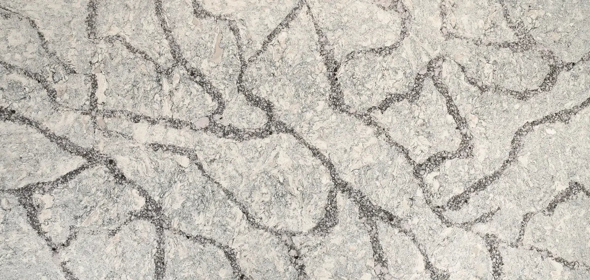 Seagrove quartz surface with light beige background and intricate gray veining pattern — premium countertop fabrication by Signature Stone Las Vegas