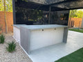 Modern outdoor stone countertop with clean lines on patio in Las Vegas backyard