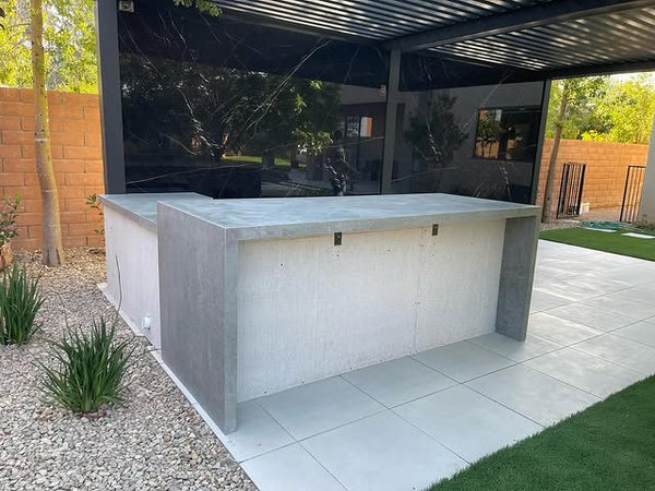 Modern outdoor stone countertop with clean lines on patio in Las Vegas backyard