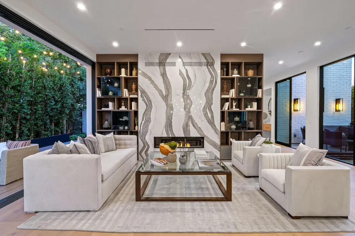 Skara Brae marble fireplace surround with dramatic white and gray veining in modern living room — premium stone countertops installed by Signature Stone Las ...