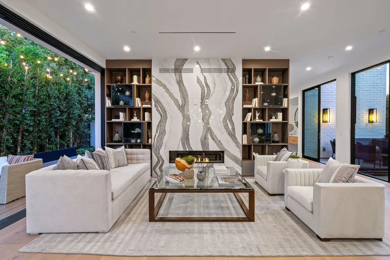 Skara Brae marble fireplace surround with dramatic white and gray veining in modern living room — premium stone countertops installed by Signature Stone Las ...