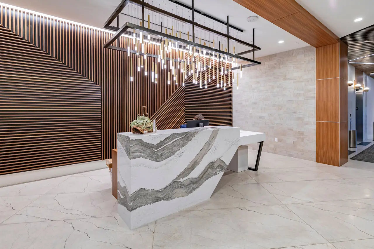 Skara Brae marble reception desk with dramatic gray veining and waterfall edge — premium stone countertops installed by Signature Stone Las Vegas