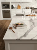 Statuario Supremo marble kitchen island with white veining and polished finish — premium stone countertops installed by Signature Stone Las Vegas