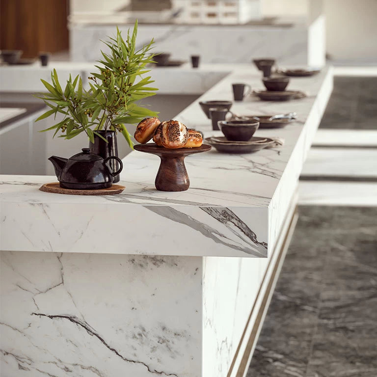 Statuario Supremo marble kitchen island with white and gray veining — premium stone countertops installed by Signature Stone Las Vegas