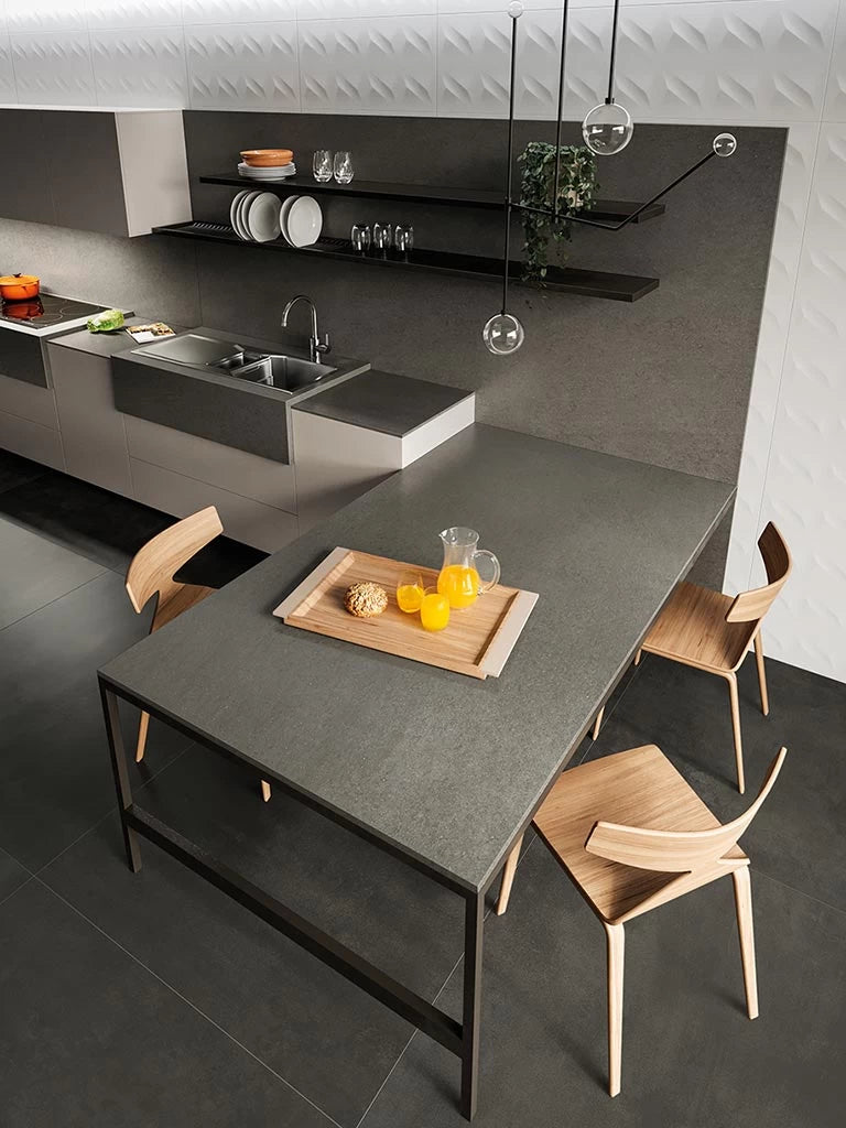 Basaltina Volcano kitchen island with dark gray finish and clean edges — custom countertops fabricated and installed by Signature Stone LV