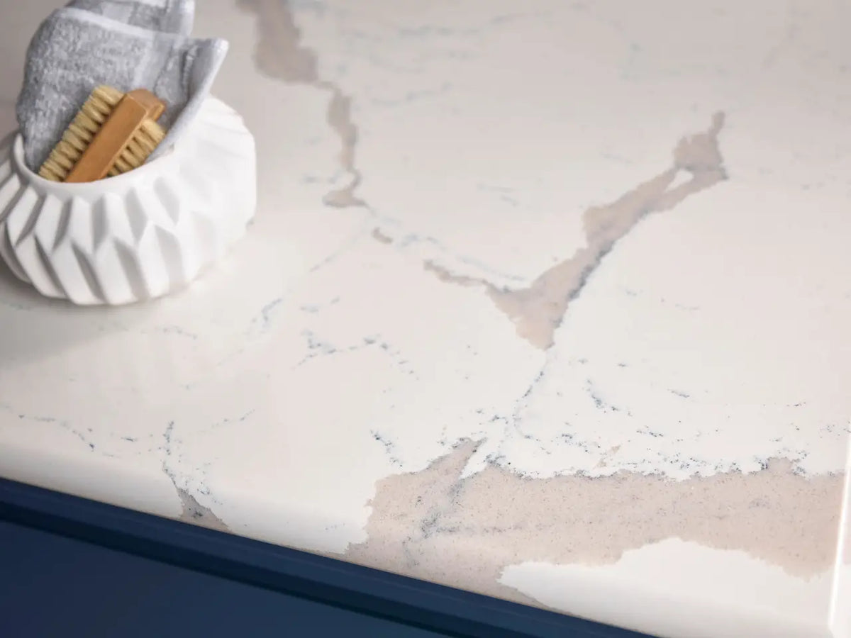 Natural stone bathroom vanity with white marble veining and polished finish — expert countertop fabrication by Signature Stone Las Vegas