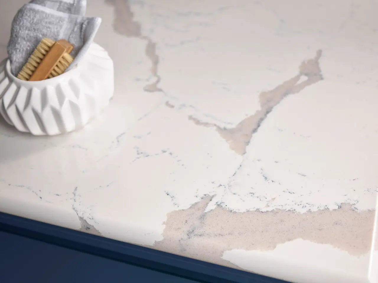 Natural stone bathroom vanity with white marble veining and polished finish — expert countertop fabrication by Signature Stone Las Vegas