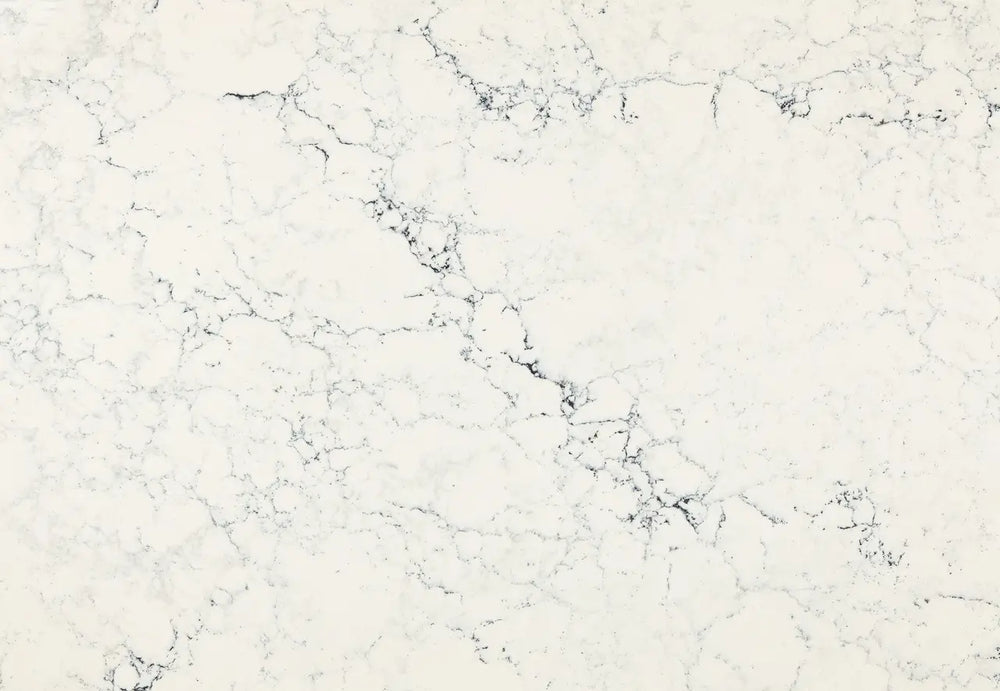Sutherland quartz surface with white background and gray veining in polished finish — custom countertops fabricated and installed by Signature Stone LV