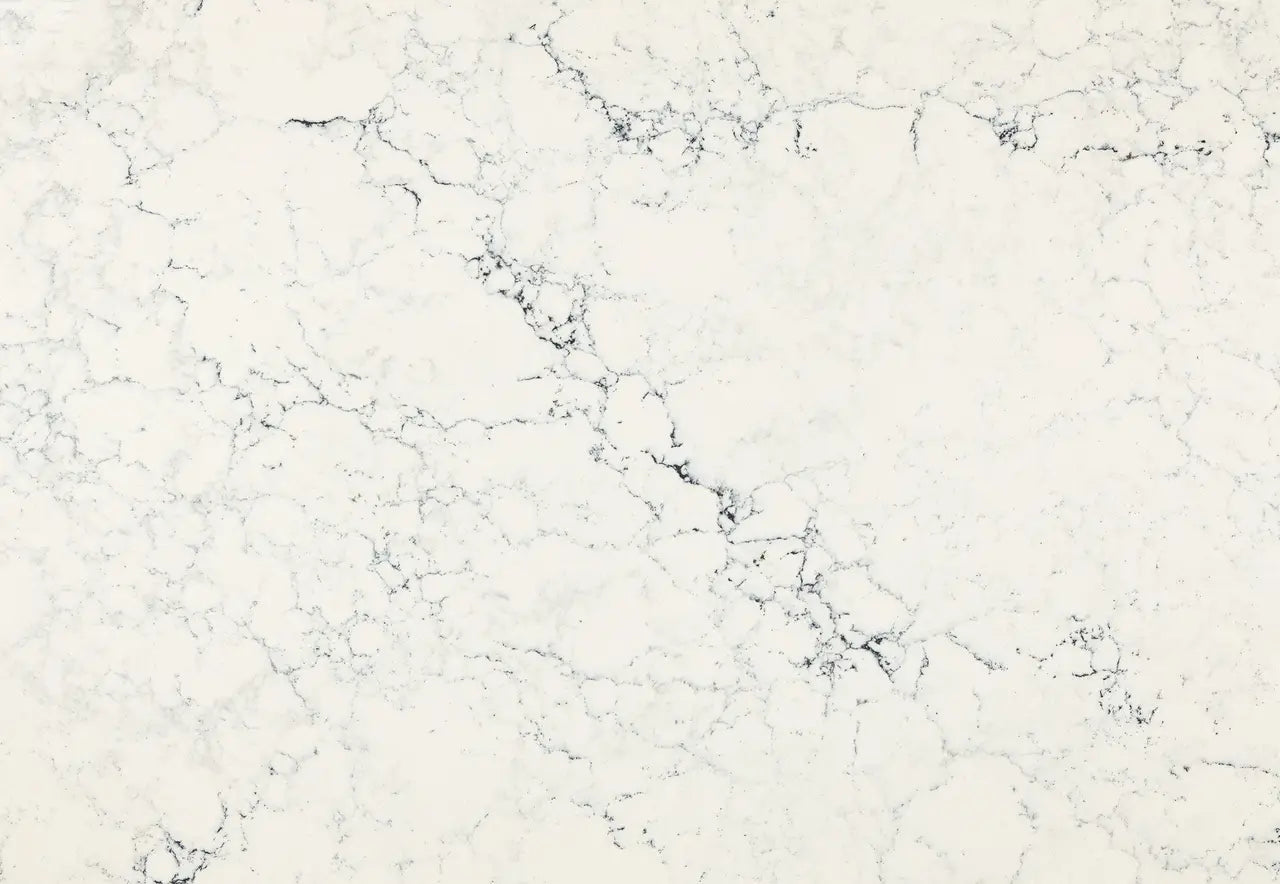 Sutherland quartz surface with white background and gray veining in polished finish — custom countertops fabricated and installed by Signature Stone LV