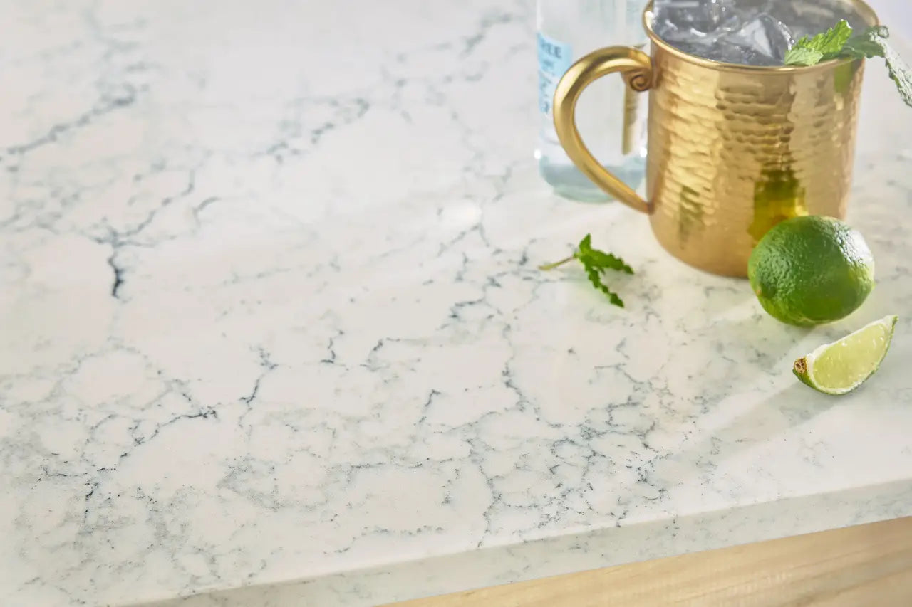 Quartz kitchen countertop with white marble veining and polished finish — premium countertop fabrication by Signature Stone Las Vegas