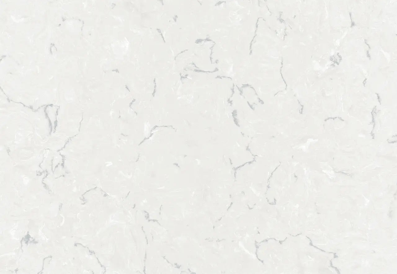Swanbridge quartz surface with soft white background and subtle gray veining in polished finish — custom countertops fabricated and installed by Signature St...