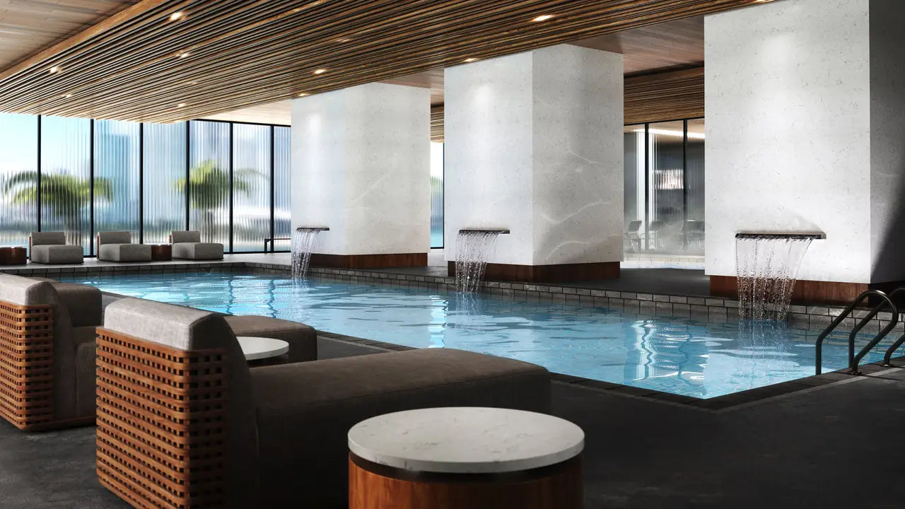 Marble pool deck and waterfall features with light veining and polished finish — luxury stone countertops installed by Signature Stone Las Vegas