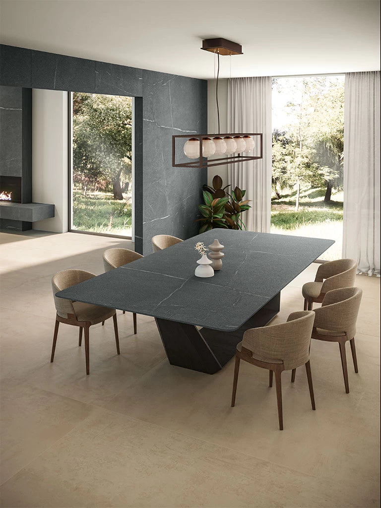 Soapstone Dark dining table with sleek gray finish and modern geometric base — premium stone countertops installed by Signature Stone Las Vegas