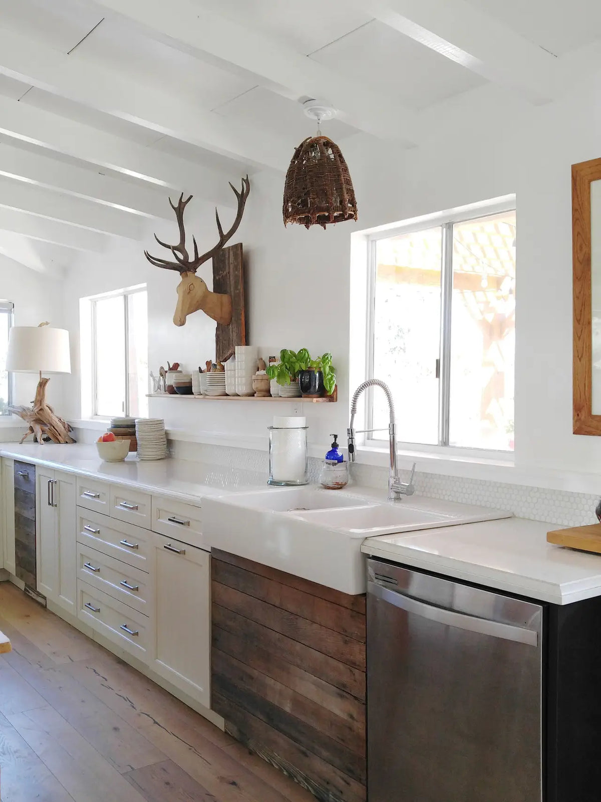 Quartz kitchen countertops with white farmhouse sink and modern design — expert countertop fabrication by Signature Stone Las Vegas