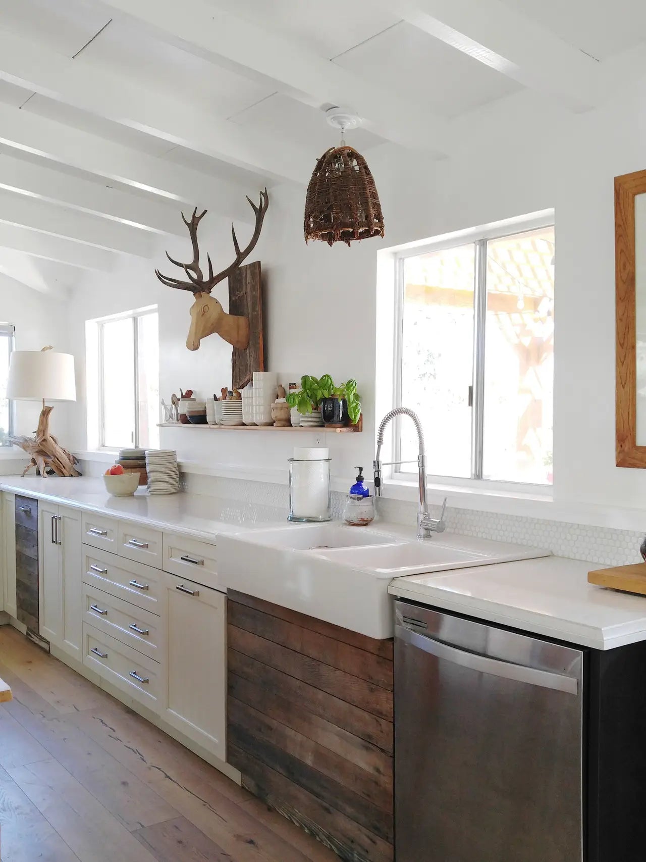 Quartz kitchen countertops with white farmhouse sink and modern design — expert countertop fabrication by Signature Stone Las Vegas